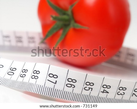 Tomato with Tape Measure. Focus on Tape Measure.