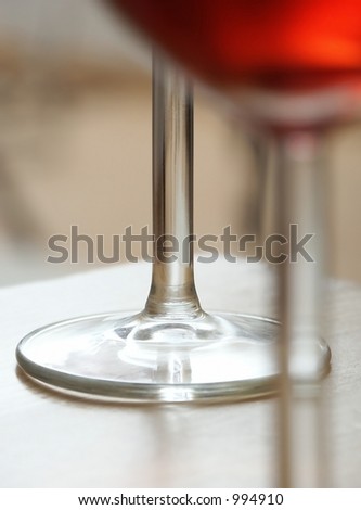 Red Wine. Bases of Glasses. Soft Focus.
