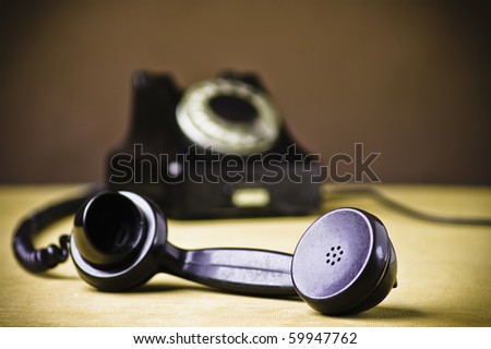 Vintage Rotary Dial Telephone. Soft focus with focus on handset.
