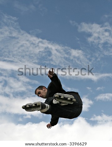 Inline Skater Jumping - Clouds and blue sky, space for text etc.