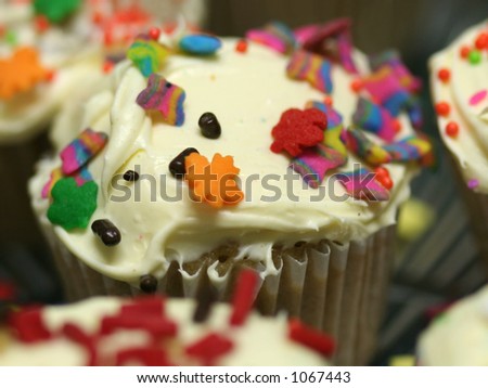 Macro of party cupcakes with sprinkles and butter cream frosting