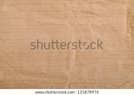 Texture of brown paper. Ecological paper with waste paper.