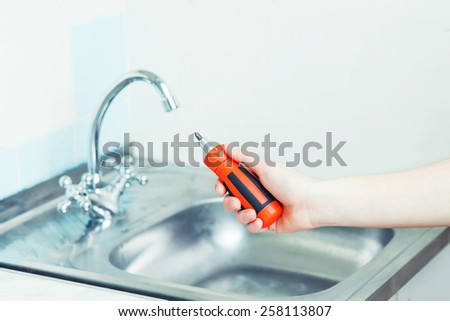 Man repairing sink. Simple repairs. To repair the house.