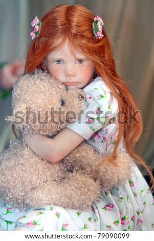 KIEV, UKRAINE - MAY 22: A collectible doll, which resembles a girl with bear, is on display at the Kyiv Fairy Tale exhibit in the 2nd annual International Doll Salon on May 22, 2011 in Kiev, Ukraine.