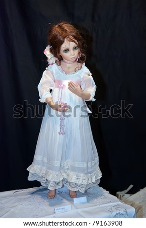 KIEV, UKRAINE - MAY 22: A collectible doll, which resembles a small girl, is on display at the Kyiv Fairy Tale exhibit in the 2nd annual International Doll Salon on May 22, 2011 in Kiev, Ukraine.