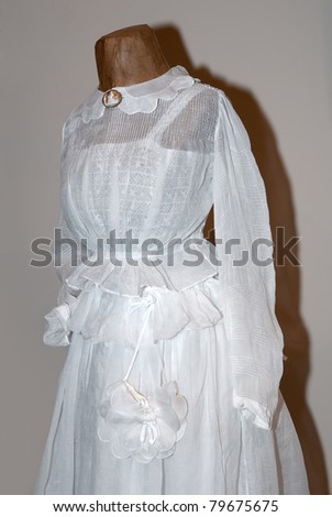 KIEV, UKRAINE - APRIL 16: An original white woman dress is on display at the Marina Ivanova\'s private collection exhibit on April 16, 2011 in Kiev, Ukraine.
