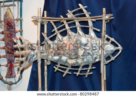 KIEV, UKRAINE - MAY 22: A collectible sculpture, which resembles a fish, is on display at the Kyiv Fairy Tale exhibit in the 2nd annual International Doll Salon on May 22, 2011 in Kiev, Ukraine.