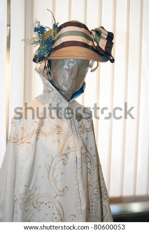 KIEV, UKRAINE - APRIL 16: An original woman's dress and hat are on display at the museum exhibit of Marina Ivanova's private collection of antique woman's clothes on April 16, 2011 in Kiev, Ukraine.