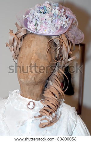 KIEV, UKRAINE - APRIL 16: A lady\'s hat with flowers is on display at the museum exhibit of Marina Ivanova\'s private collection of antique woman\'s clothes on April 16, 2011 in Kiev, Ukraine.