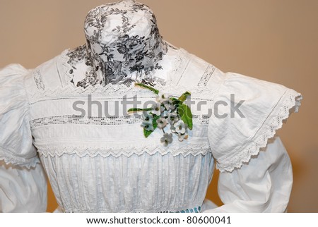 KIEV, UKRAINE - APRIL 16: A fragment of a girl\'s dress is on display at the museum exhibit of Marina Ivanova\'s private collection of antique woman\'s clothes on April 16, 2011 in Kiev, Ukraine.