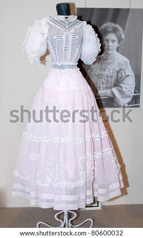 KIEV, UKRAINE - APRIL 16: An original pink woman\'s dress is on display at the museum exhibit of Marina Ivanova\'s private collection of antique woman\'s clothes on April 16, 2011 in Kiev, Ukraine.