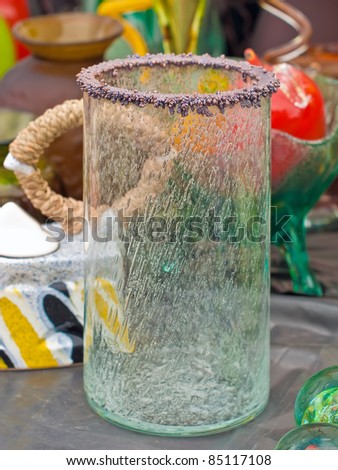 KIEV, UKRAINE - AUGUST 21: A tall thin-walled cracked transparent floor-level vase at the fair of the 56th annual flower exhibition on August 21, 2011 in Kiev, Ukraine.