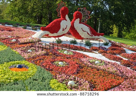 KIEV, UKRAINE - AUGUST 21: Two red fantastic birds made of flowers at the 55th annual flower exhibition on August 21, 2010 in Kiev, Ukraine.