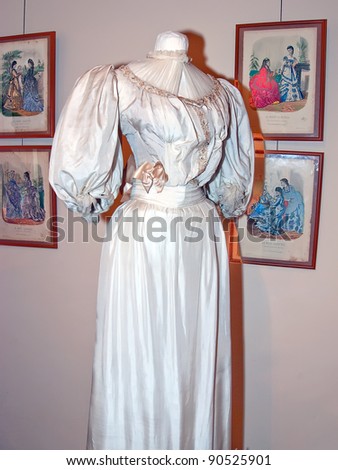 KIEV, UKRAINE - APRIL 16: An original white woman dress with bow is on display at the Marina Ivanova\'s private collection exhibit on April 16, 2011 in Kiev, Ukraine.