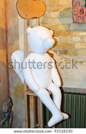KIEV, UKRAINE - JANUARY 09: A collectible doll, which resembles a white plush angel bear, is on display at the Angel Age exhibit of Author\'s Dolls on January 09, 2012 in Kiev, Ukraine.