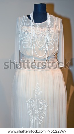 KIEV, UKRAINE - APRIL 16: An original white woman\'s dress with beards is on display at the Marina Ivanova\'s private collection exhibit on April 16, 2011 in Kiev, Ukraine.