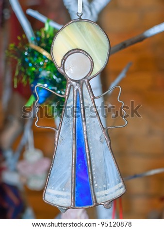 KIEV, UKRAINE - JANUARY 09: A collectible Christmas-tree decoration, which resembles an angel with nimbus, is on display at the Angel Age exhibit of Author\'s Dolls on January 09 2012 in Kiev, Ukraine