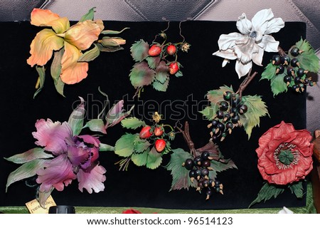 KIEV, UKRAINE - FEBRUARY 26: Artificial flowers hear pins and brooches are on display at the Fashion Doll International exhibit on February 26, 2012 in Kiev, Ukraine.