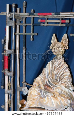 KIEV, UKRAINE - MAY 22: A collectible doll, which resembles a Chinese cat, is on display at the Kyiv Fairy Tale exhibit in the 2nd annual International Doll Salon on May 22, 2011 in Kiev, Ukraine.