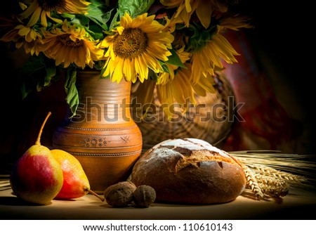 autumn still life with bread and sunflower