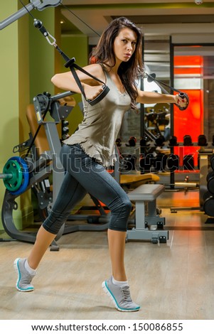 attractive young woman is engaged in fitness sport club