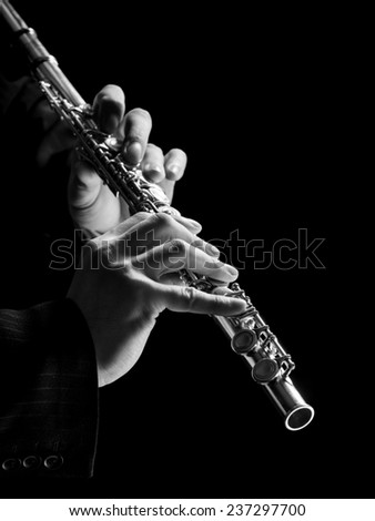 Flute in hands - music background