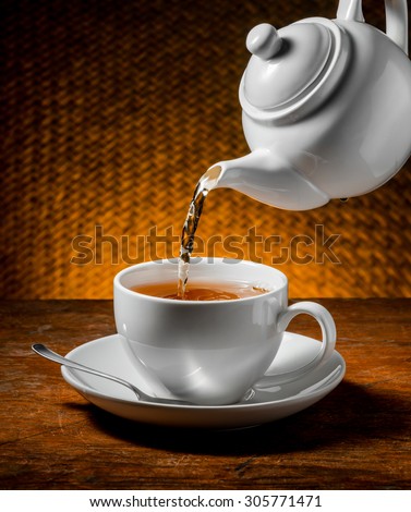 Tea being poured into cup