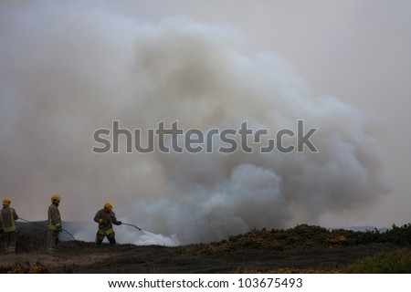 Heath Fire on The Range Isle of Anglesey North Wales being fought by firemen