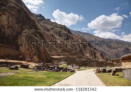 Ollantaytamo, temples sun, and moon with Inca Terraces, Ten, Niches made of  pink, rhyolite, and , Pinculluna, hill in the background