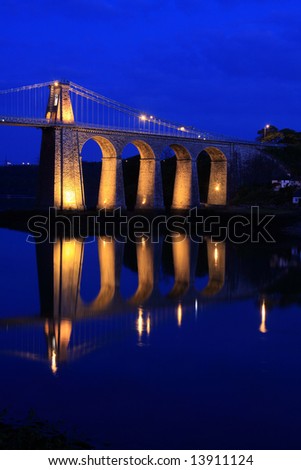 Menai Bridge reflections of the town and Suspension bridge