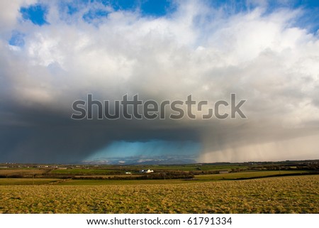 Hail storm clouds  blowing towards the Snowdonian Mountains from the Isle of Anglesey