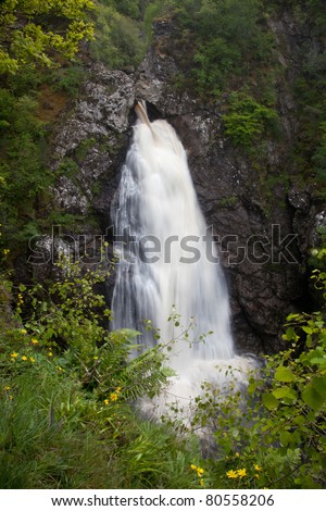 The water flowwing out as a waterfall from Forres Hyrdo electric dam Scotland