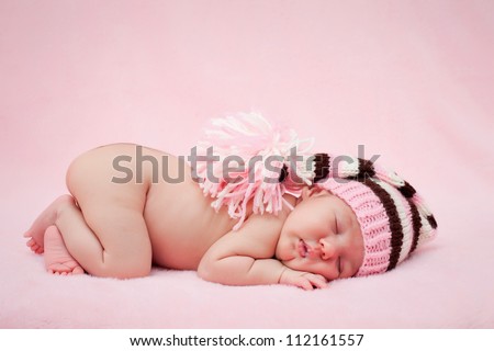 Newborn baby girl right after delivery.Sweet baby girl portrait. Use the photo to represent life, parenting or childhood. Shallow focus.