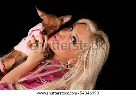 stock photo Women in pink kiss little dog pussy