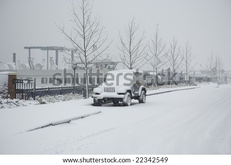 Winter Season Snow Covering Car Boat at back