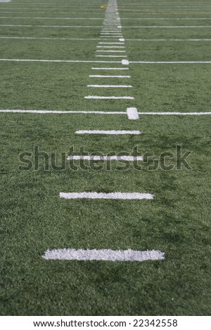 sports court with yards marked in white