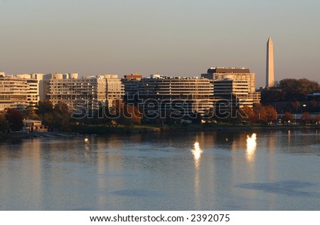 Watergate Complex and Washington Monument in DC at sunset