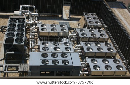 Air Conditioner Cooling Fans on the roof of an office building.
