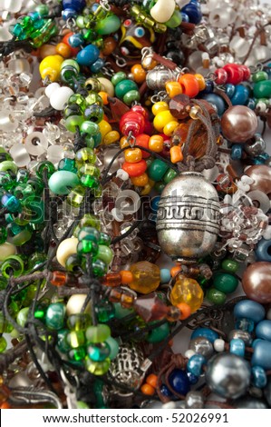 Heap of glass bead accessories. Homemade jewelry