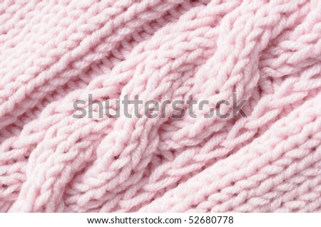 Clew and needles on pink knitted pattern. Hand made linen.