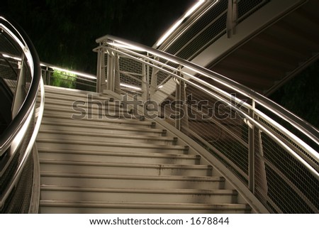 Stairs lit by neon light
