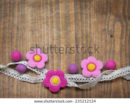 Lovely background with felted flowers and balls
