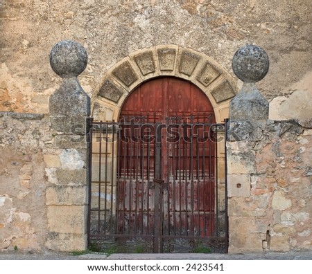 Old church door of medieval village in Spain