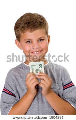 Young boy holding a bunch of folded money and smiling. Image isolated on white.