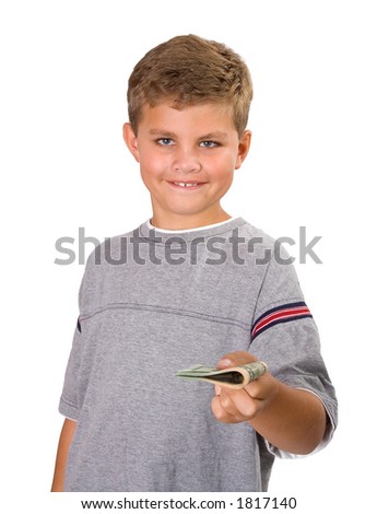 Young boy handing over a bunch of folded money. Image isolated on white.
