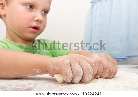 boy rolls the dough