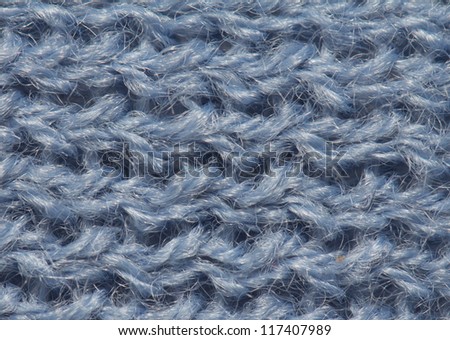 closeup of seamless blue knitted fabric texture