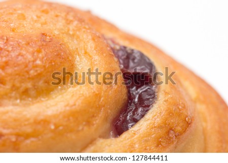 cake with jam in the background