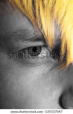 yellow lock of hair on the eye