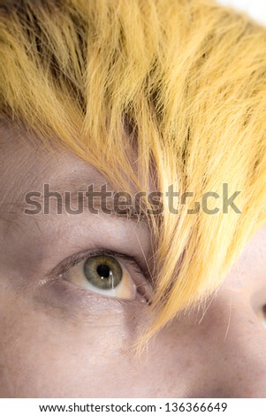 yellow lock of hair on the eye
